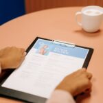 person holding black tablet computer